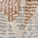 Handknotted Moroccan style rug sample in a textural cream grey and tan pattern.