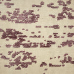 Textured fabric rug pattern with purple and beige colors