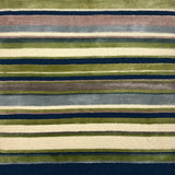 Striped rug with a pattern of green, blue, and beige stripes on a dark blue background.
