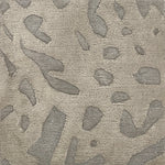 Handknotted rug with abstract animal motif in tonal grey. 