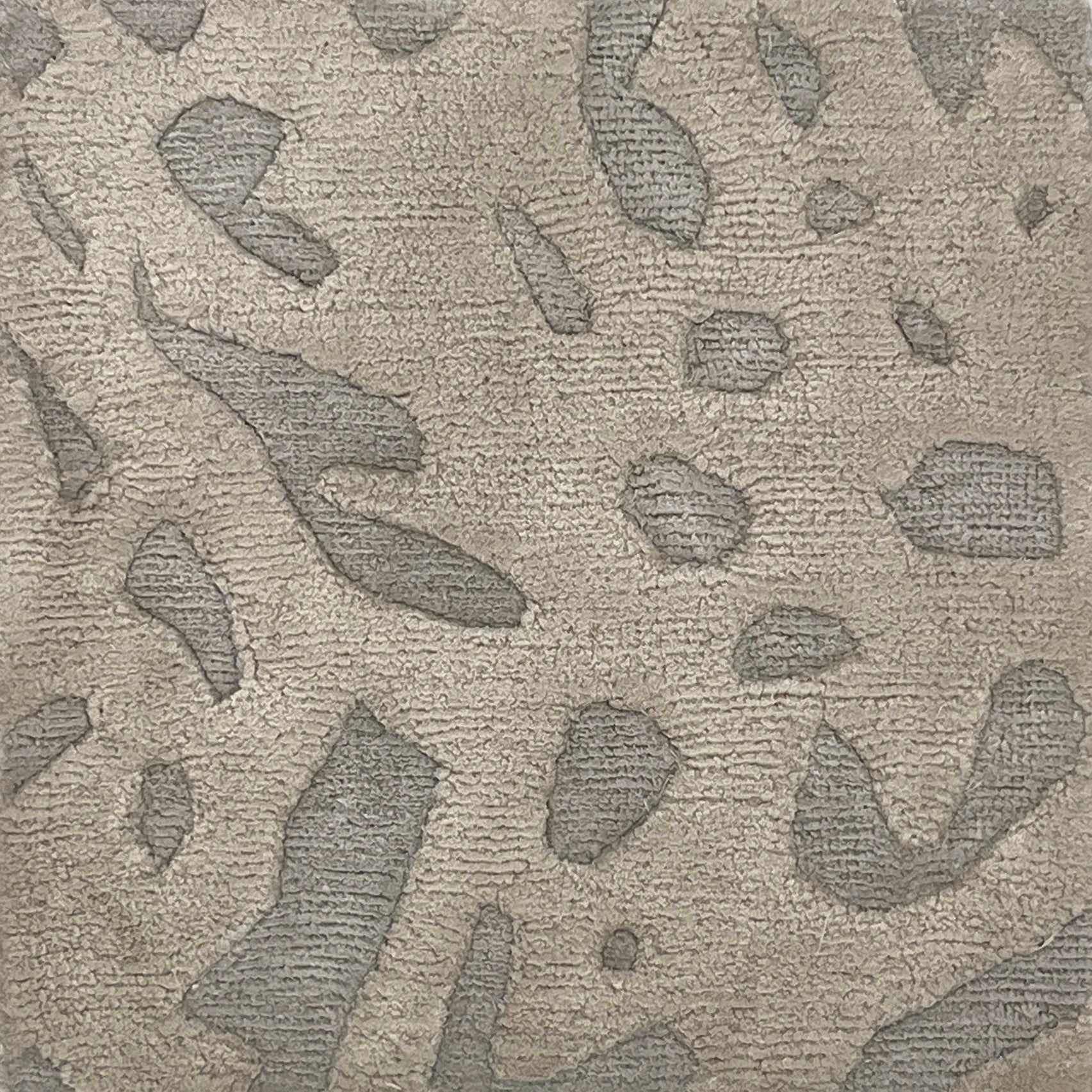 Handknotted rug with abstract animal motif in tonal grey. 