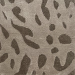 Handknotted rug with abstract animal motif in grey and taupe.  