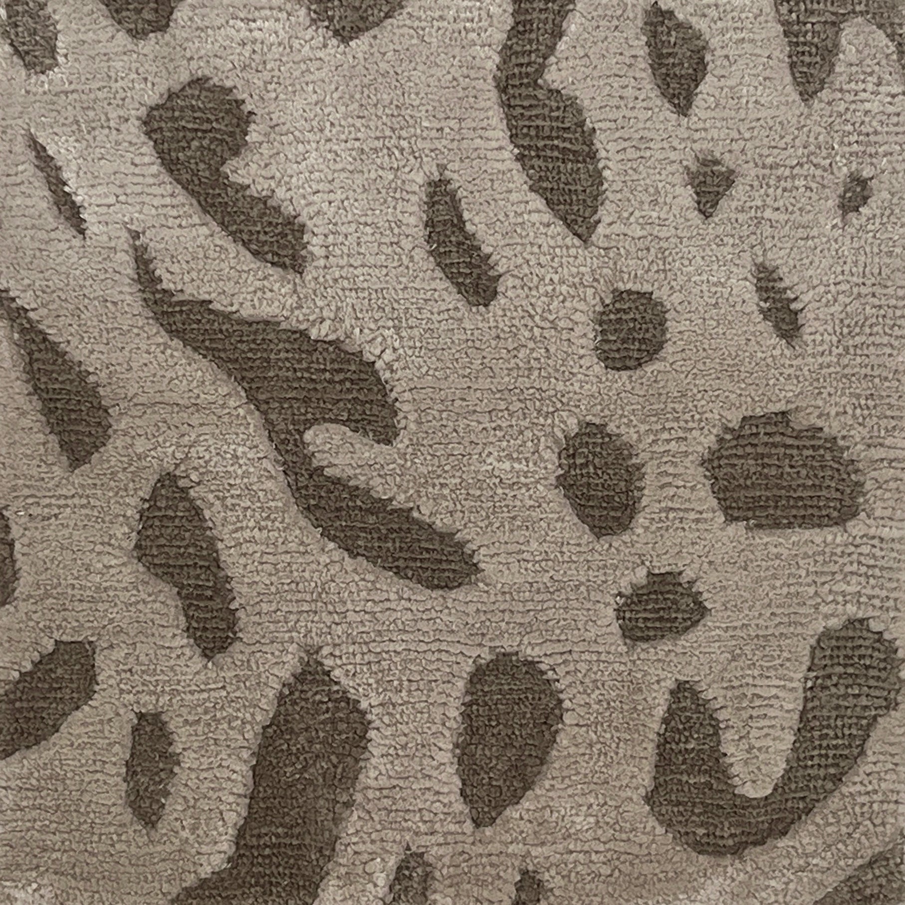 Handknotted rug with abstract animal motif in grey and taupe.  