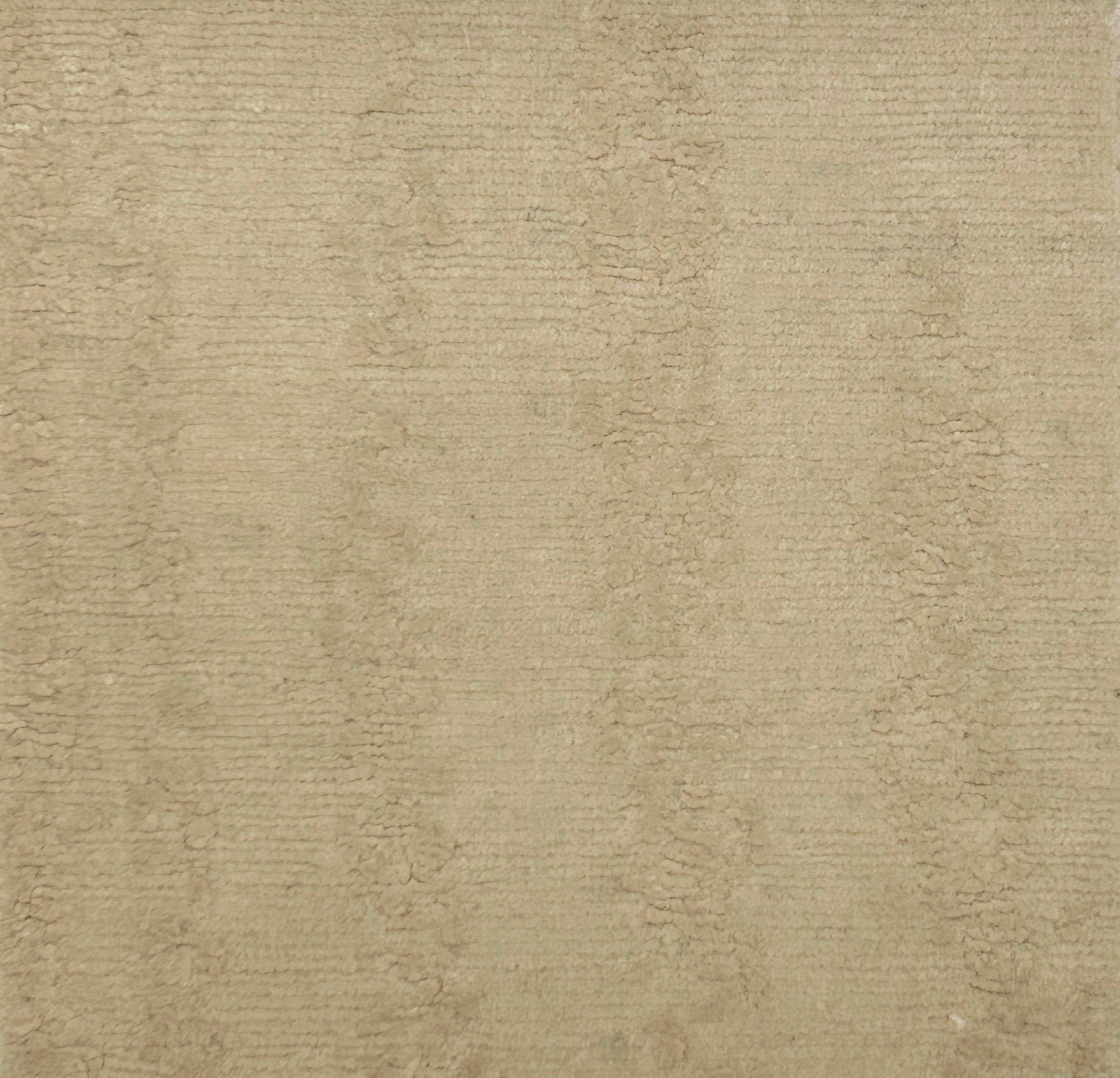 Textured beige carpet with a subtle pattern