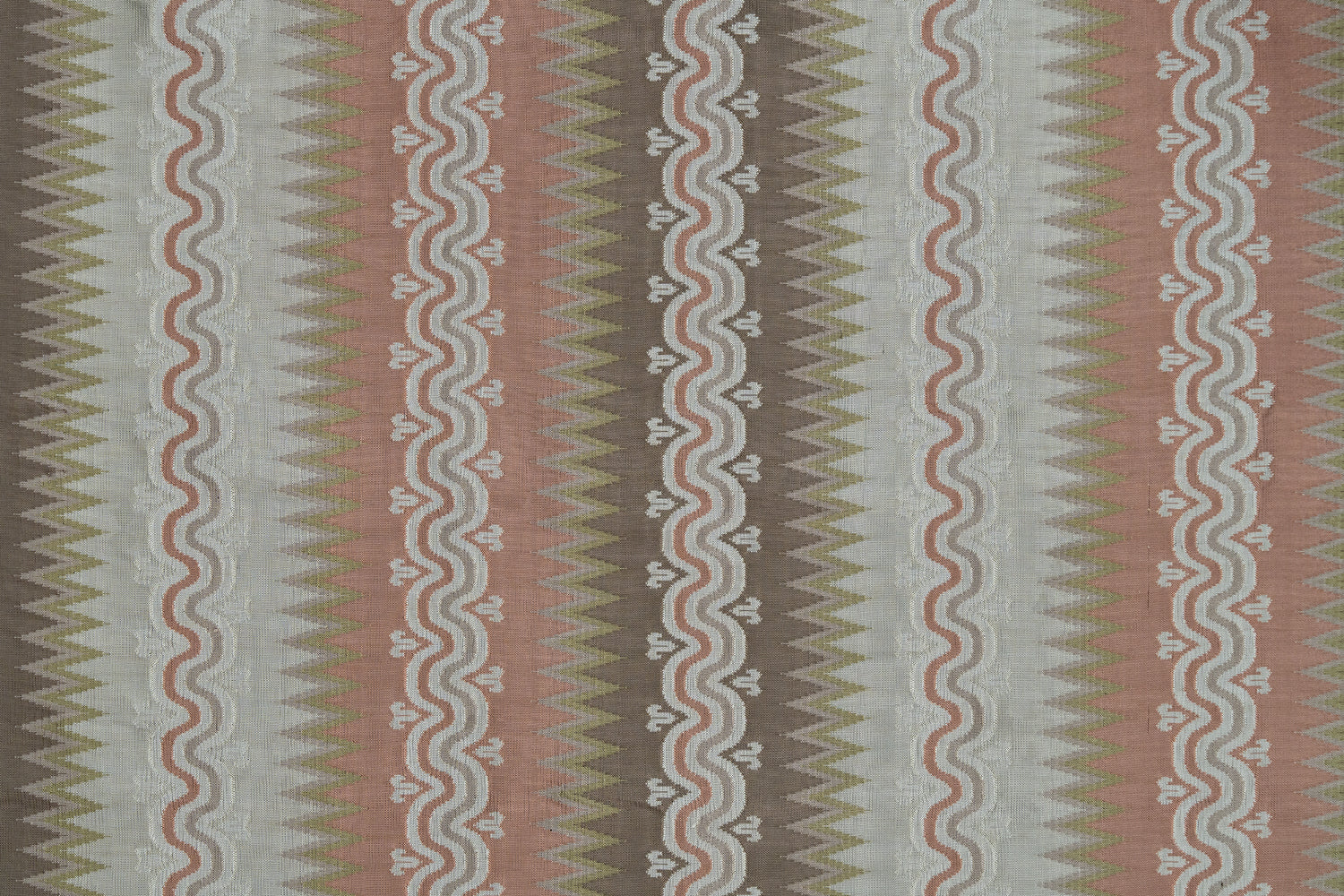 Handwoven silk fabric with wavy lines in pink, brown, green, and ivory.