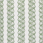 Fabric in a botanical stripe print in green on a white field.