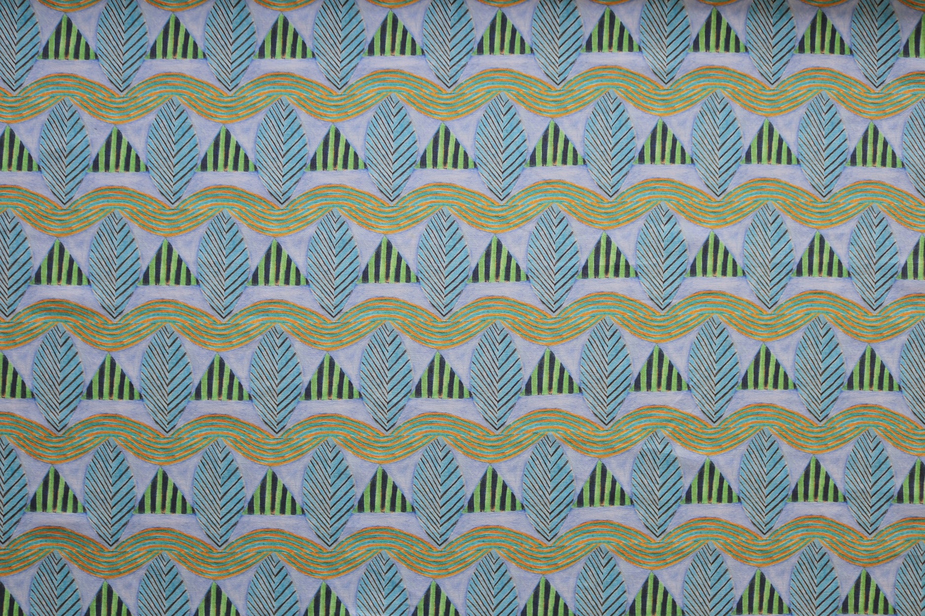 A close-up of a patterned fabric featuring repeating rows of stylized green leaves and wavy olive-yellow lines, striped blue and green triangles on a pale purple background.
