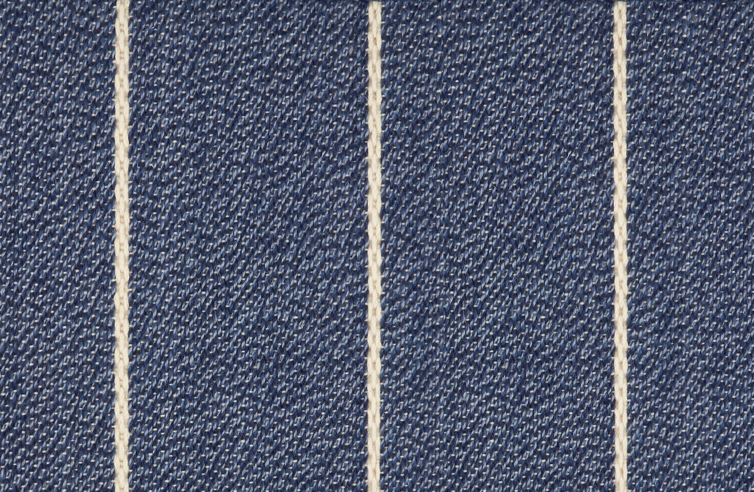 Broadloom carpet in a thin ivory stripe on a field of marine blue. 