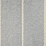 Broadloom carpet in a thin ivory stripe on a field of light blue.