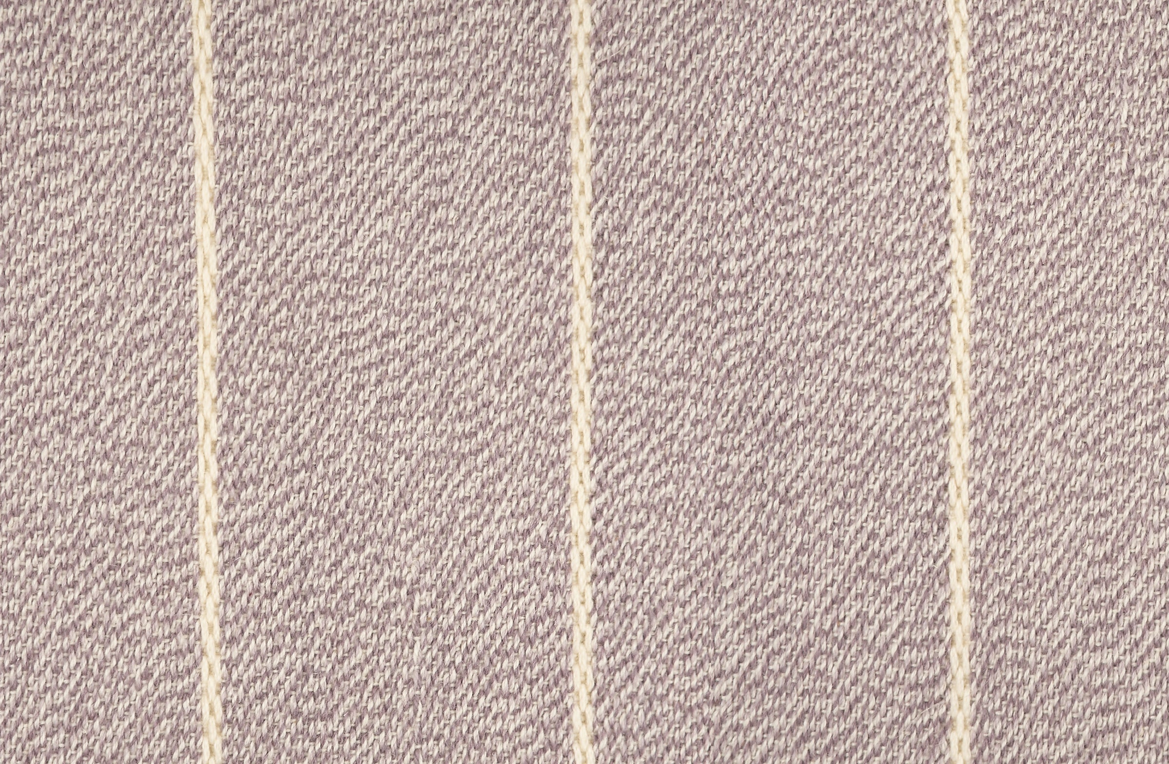 Broadloom carpet in a thin ivory stripe on a field of light purple.