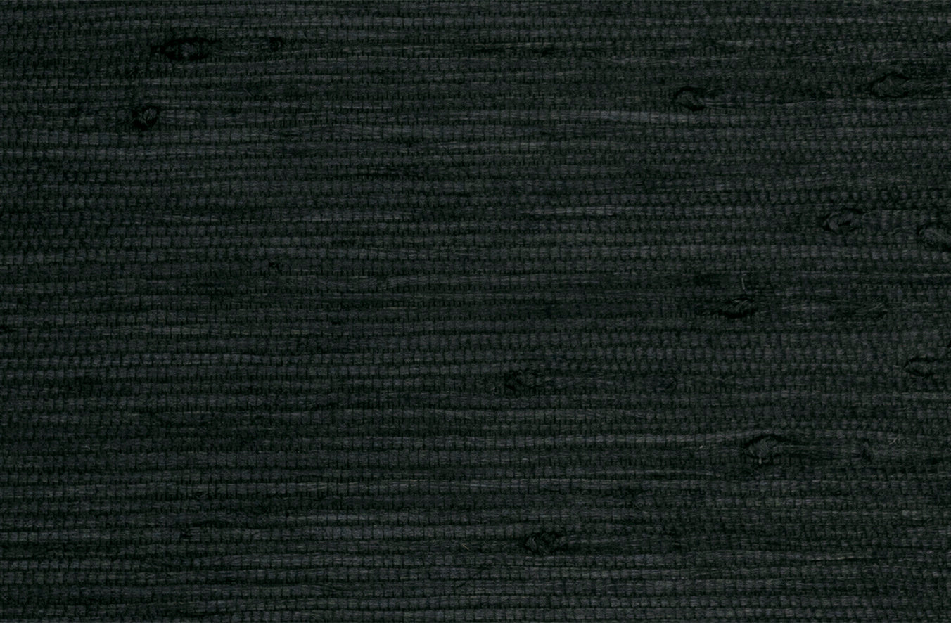 Detail of a grasscloth wallpaper with a jute with rich texture in inky black.