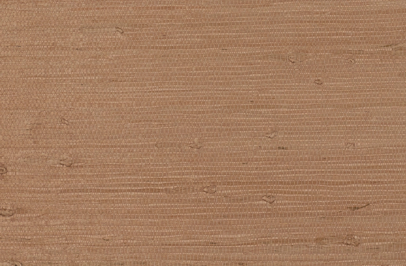 Detail of a jute grasscloth wallpaper in warm clay.