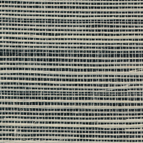 Detail of a sisal grasscloth wallpaper in white on a black paper backing.