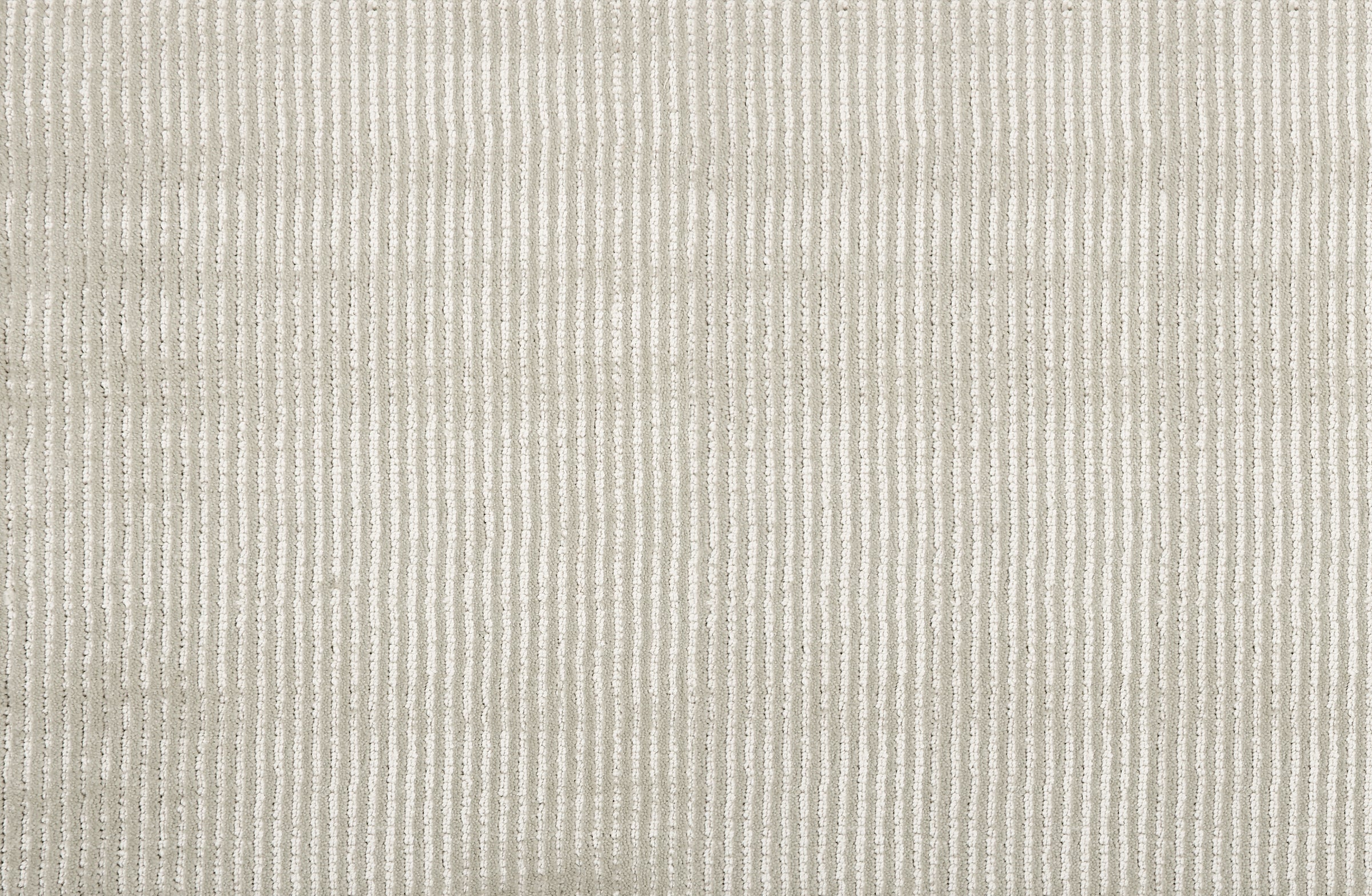 Broadloom carpet sample in a thin ribbed stripe in light grey. 