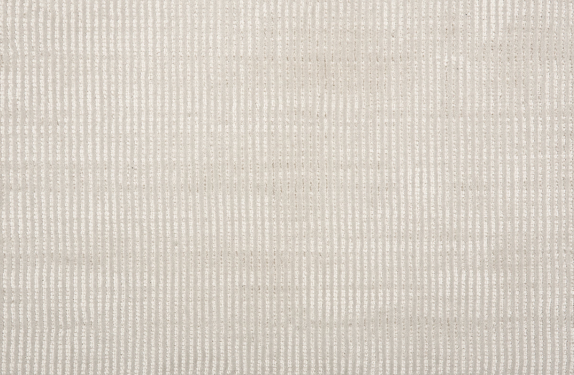 Broadloom carpet sample in a thin ribbed stripe in off white. 