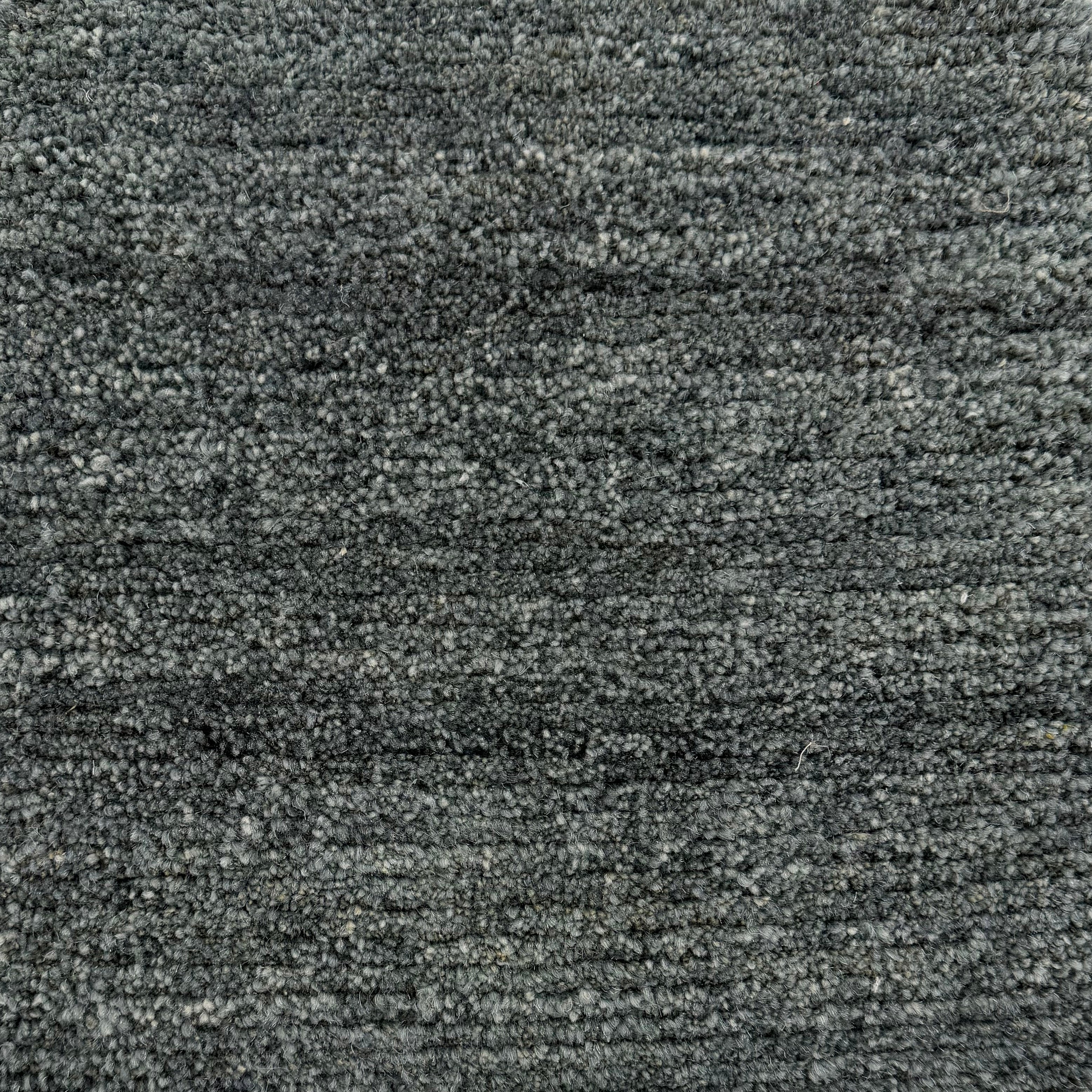 Handknotted cut pile rug in slate blue. 