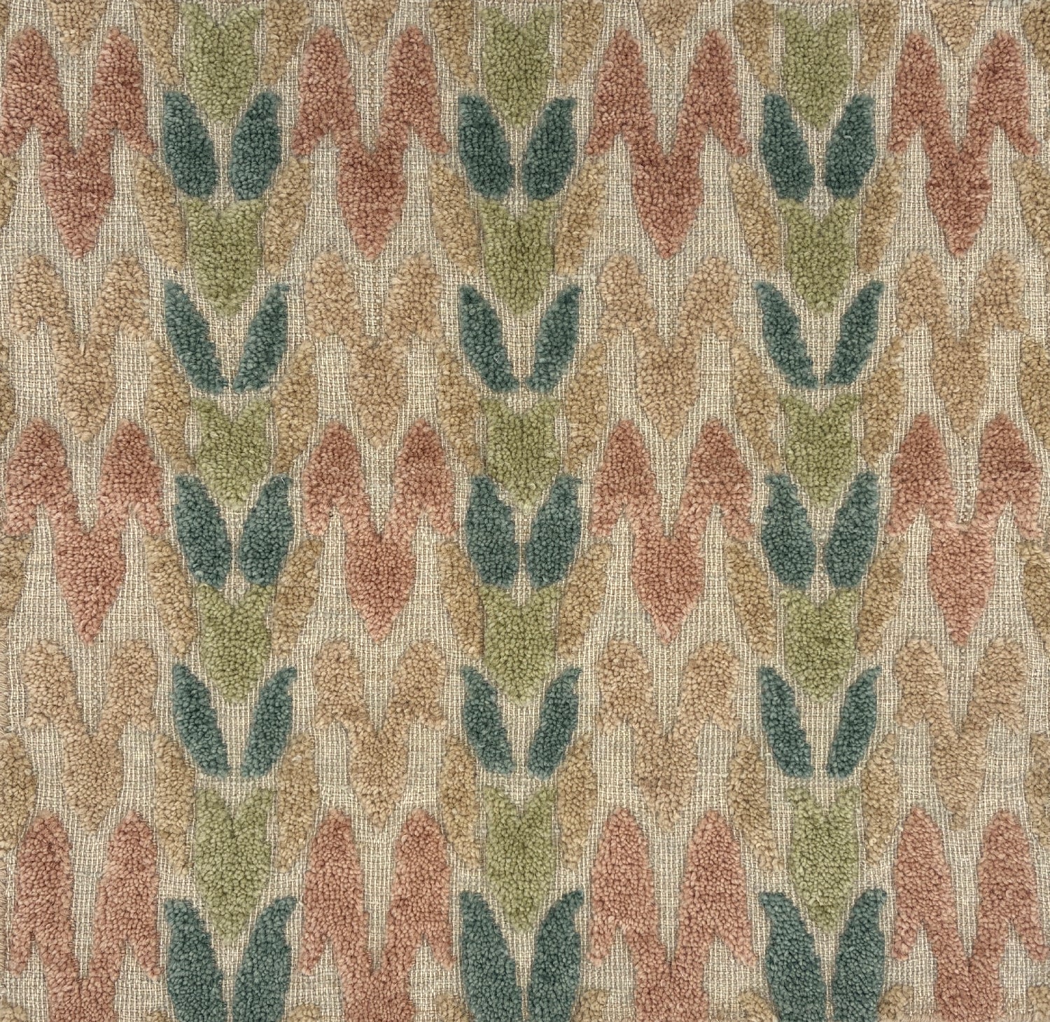 Textured fabric with a leaf pattern in pastel tones on a beige background