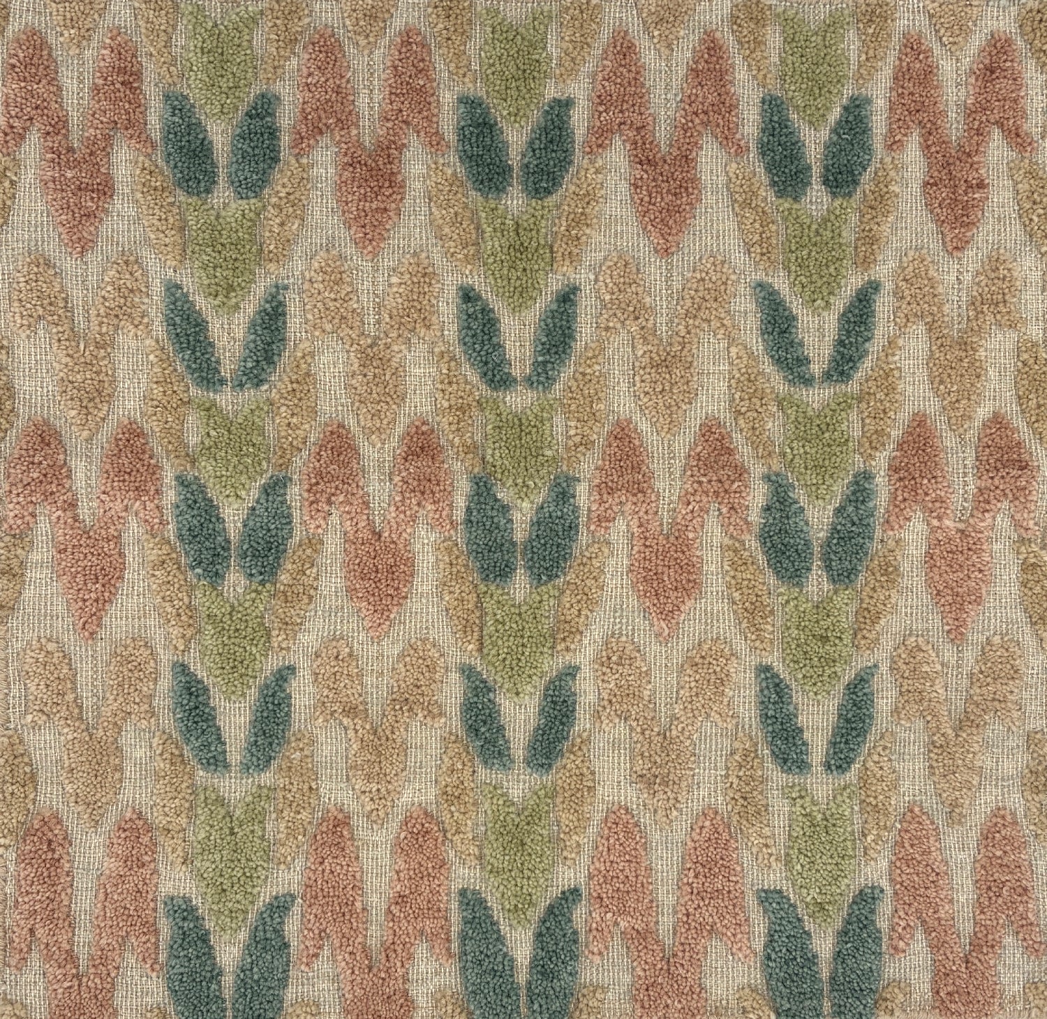 Textured fabric with a leaf pattern in pastel tones on a beige background