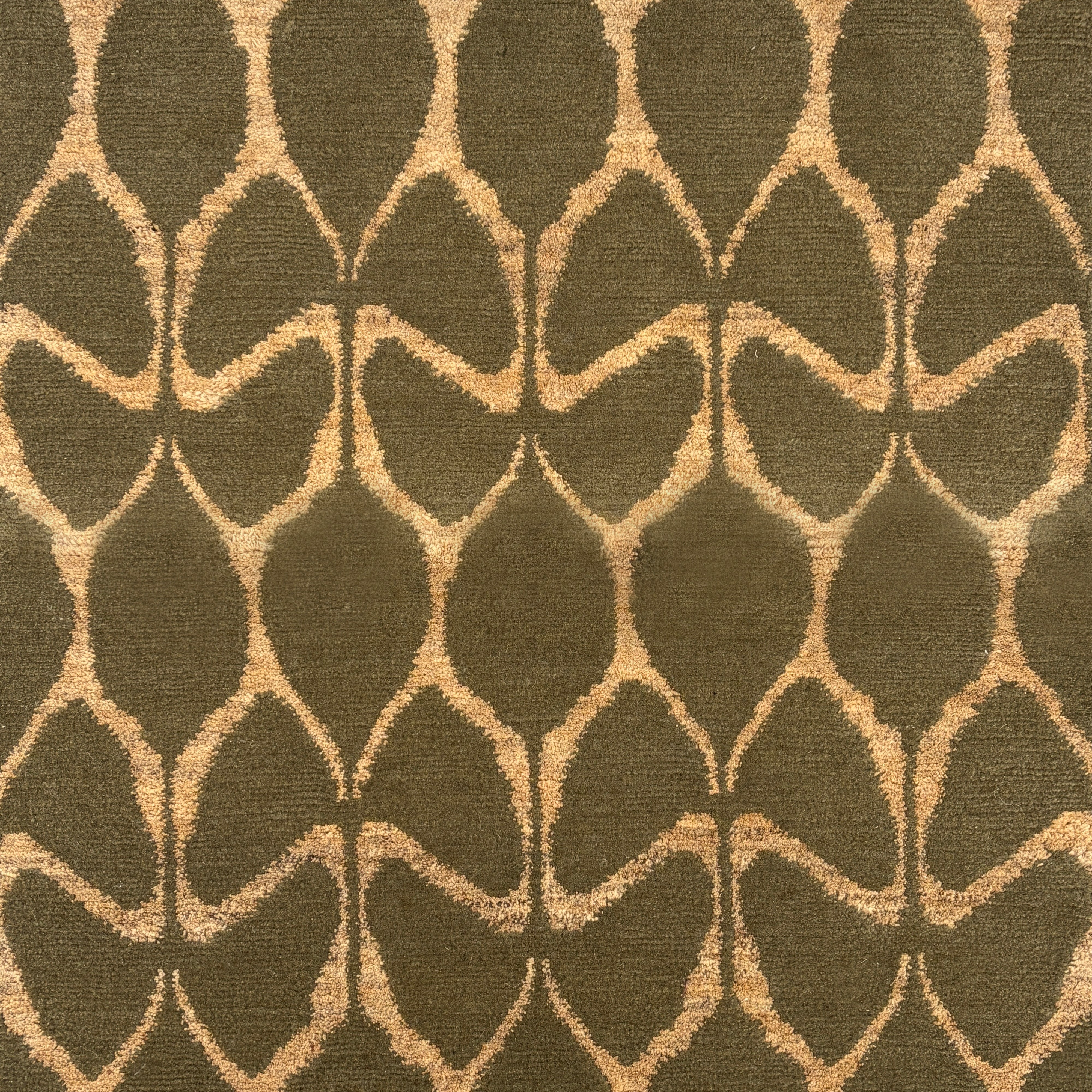 Patterned fabric with geometric design on a dark green background