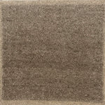 Brown Solid rug with a textured  pattern