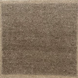 Brown Solid rug with a textured  pattern