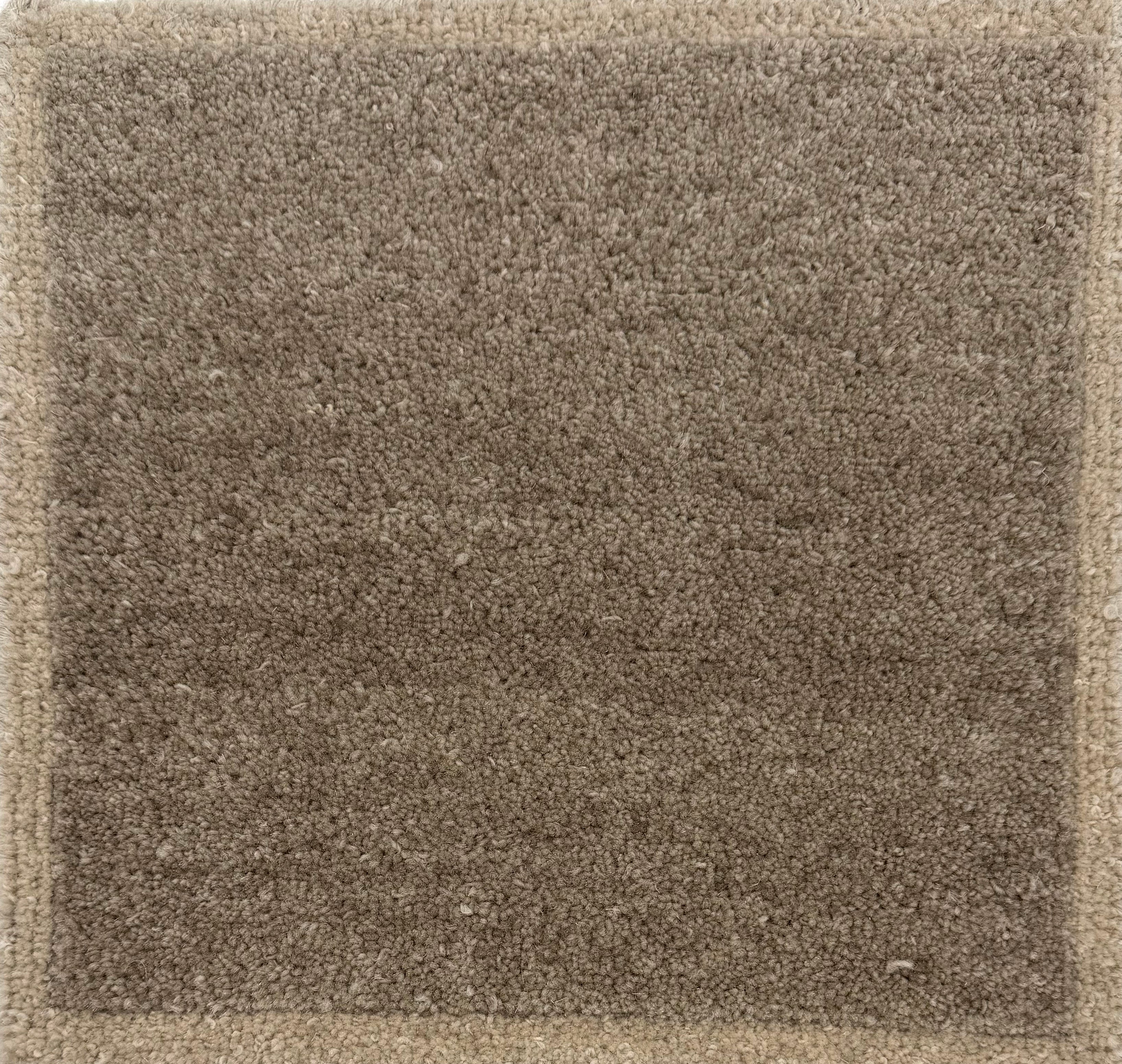 Brown Solid rug with a textured  pattern