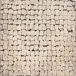 A rug with irregular squares generally in stripes with a brown ground and ivory squares.