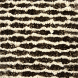 Handknotted rug in a wavy stripe in chocoliate brown and cream. 