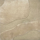 Handknotted cut pile wool rug in ivory with raised cut pile abstract shapes