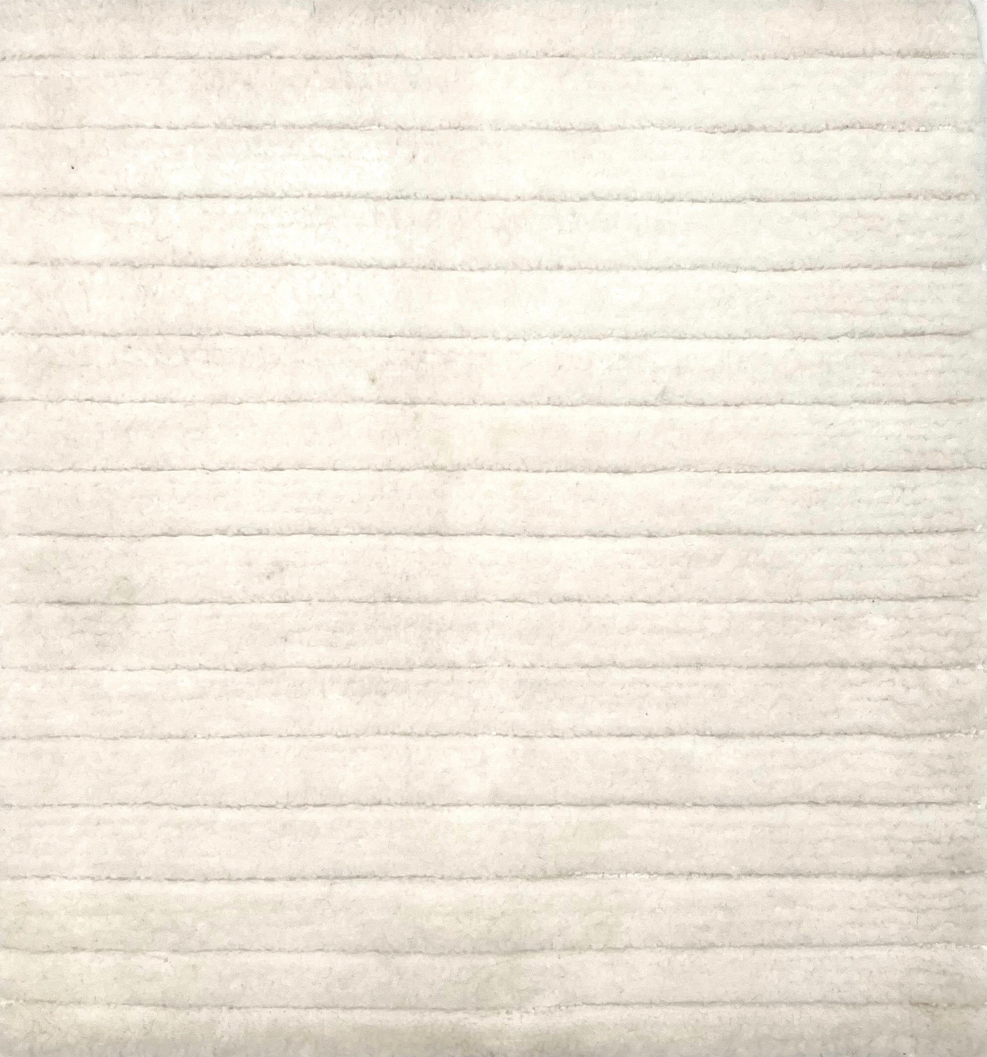 Handknotted custom rug with ribbed cut pile stripes in white wool. 