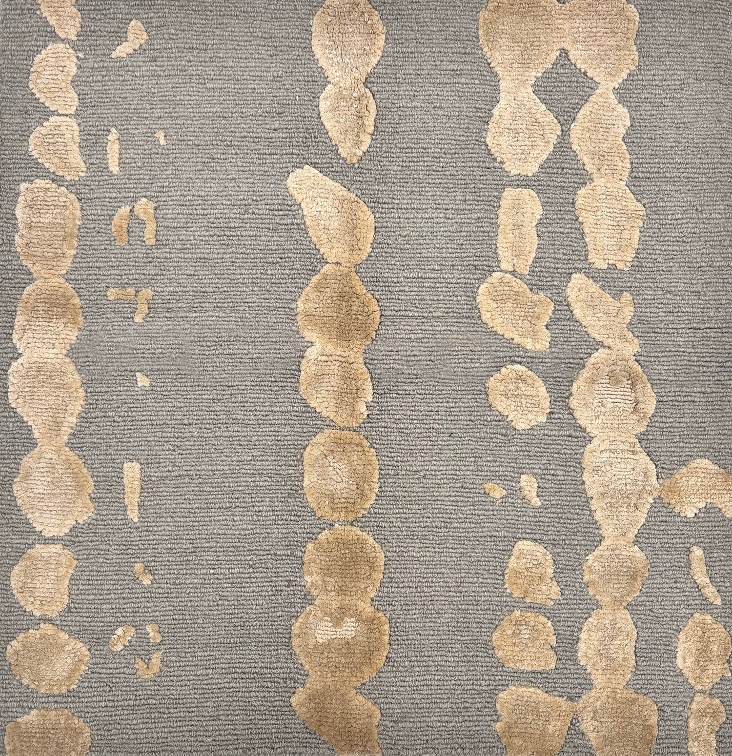 Handknotted rug sample in a bold painterly design in taupe and grey. 