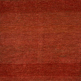 Handknotted rug in a burnt orange and brown weave.