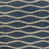 Handknotted rug with serpetine stripe in grey on a blue field. 