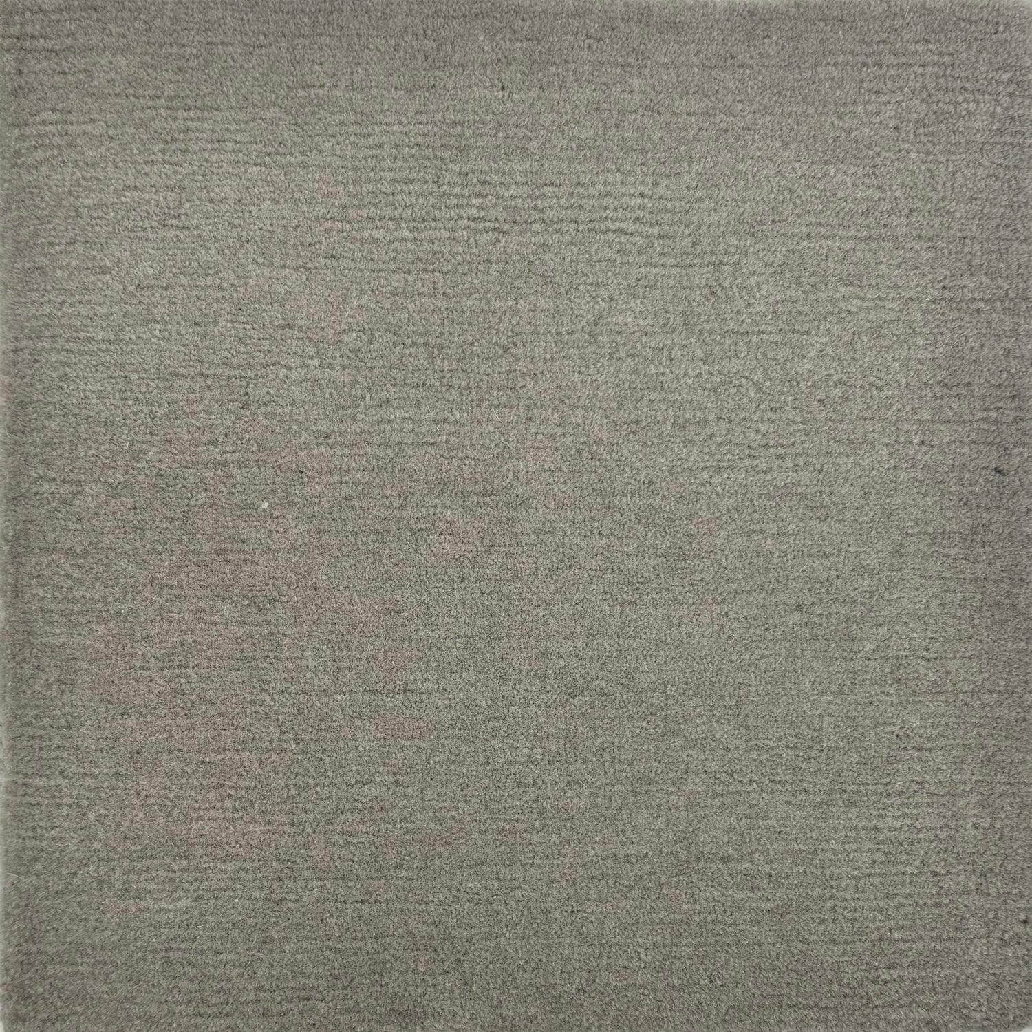 Handknotted rug sample in solid grey.