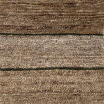 Handknotted rug with natural fibre stripe design. 