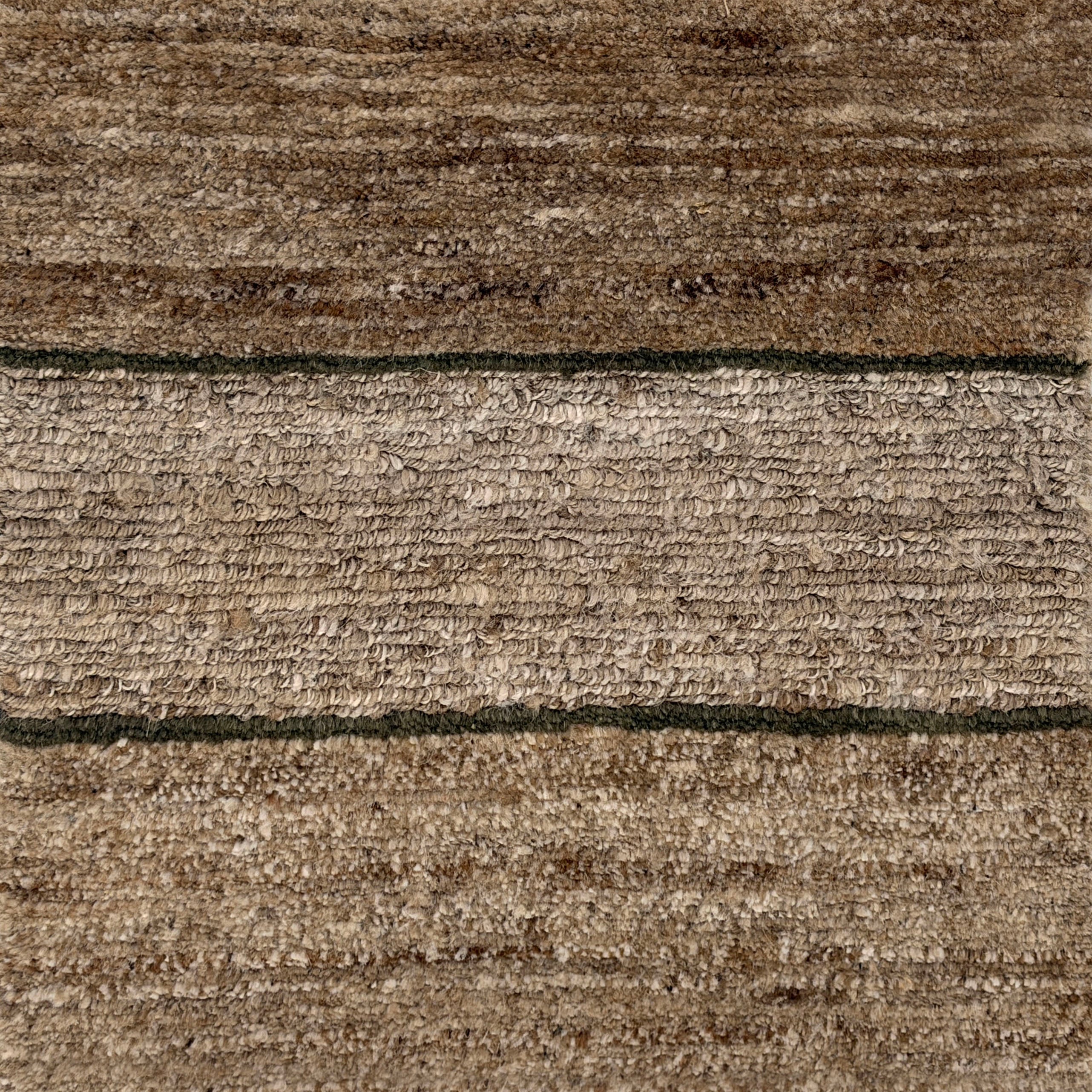 Handknotted rug with natural fibre stripe design. 