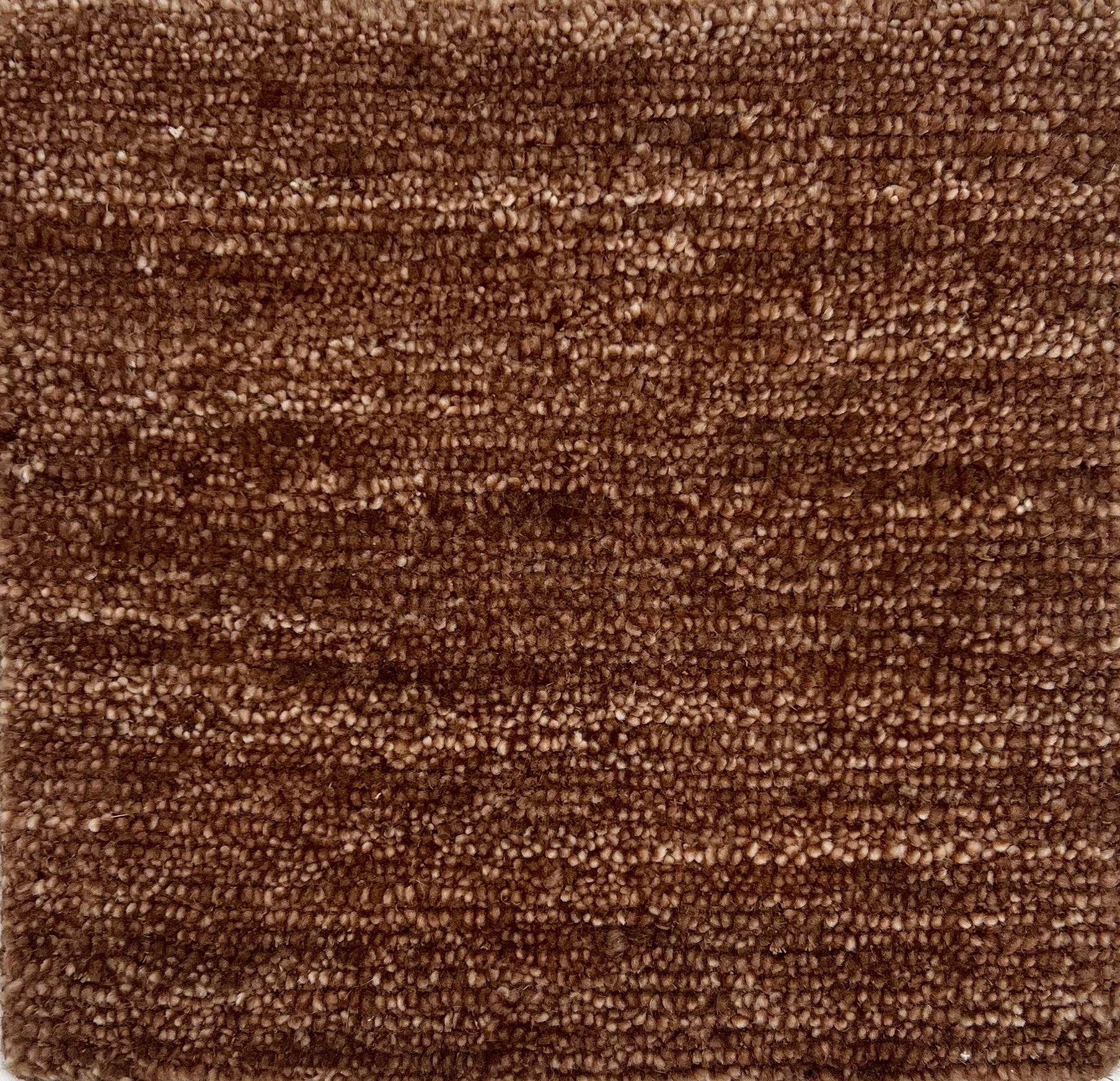 Handknotted rug in a strie brown solid. 