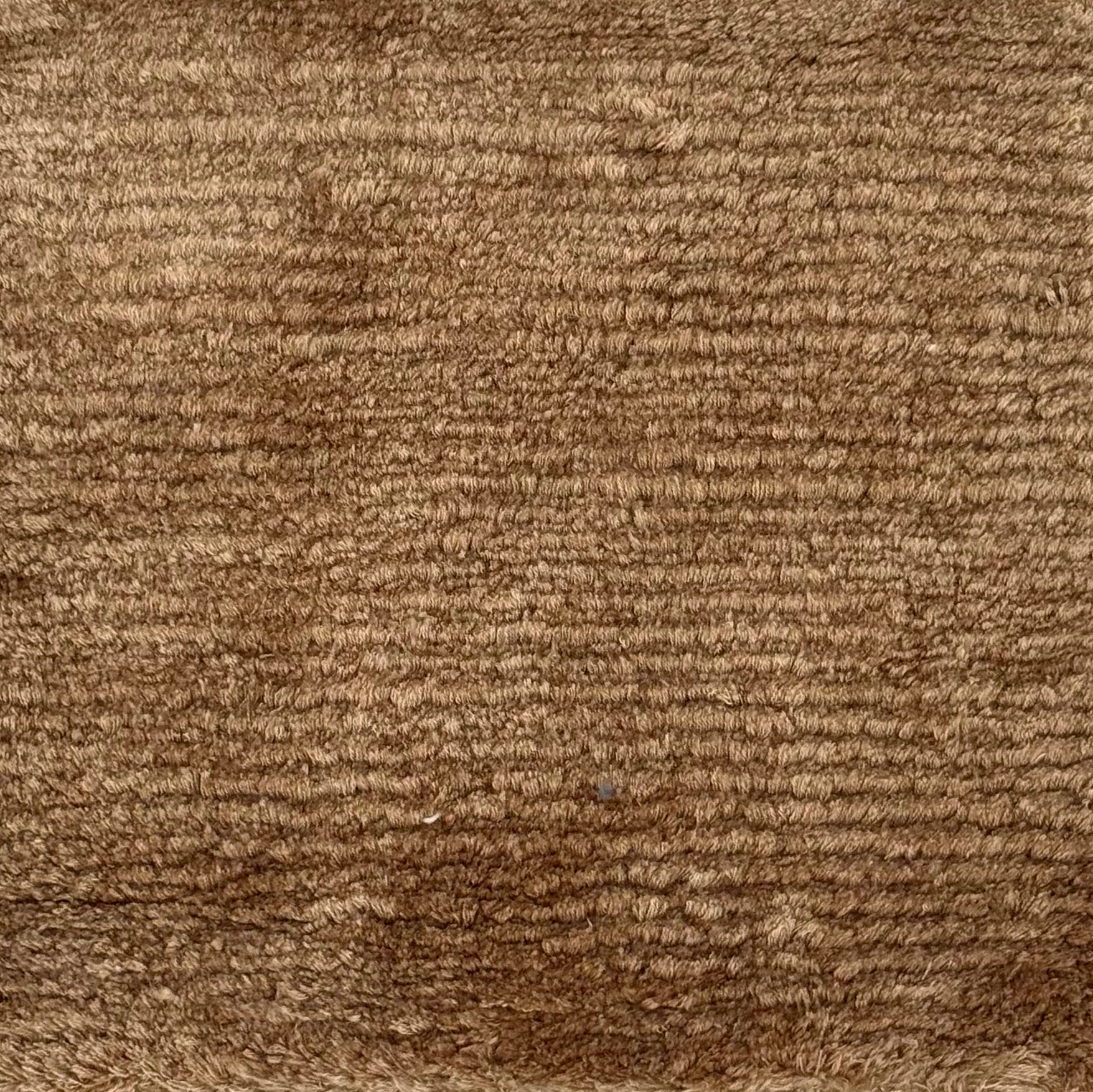 Handknotted rug with solid cut pile in warm brown silk
