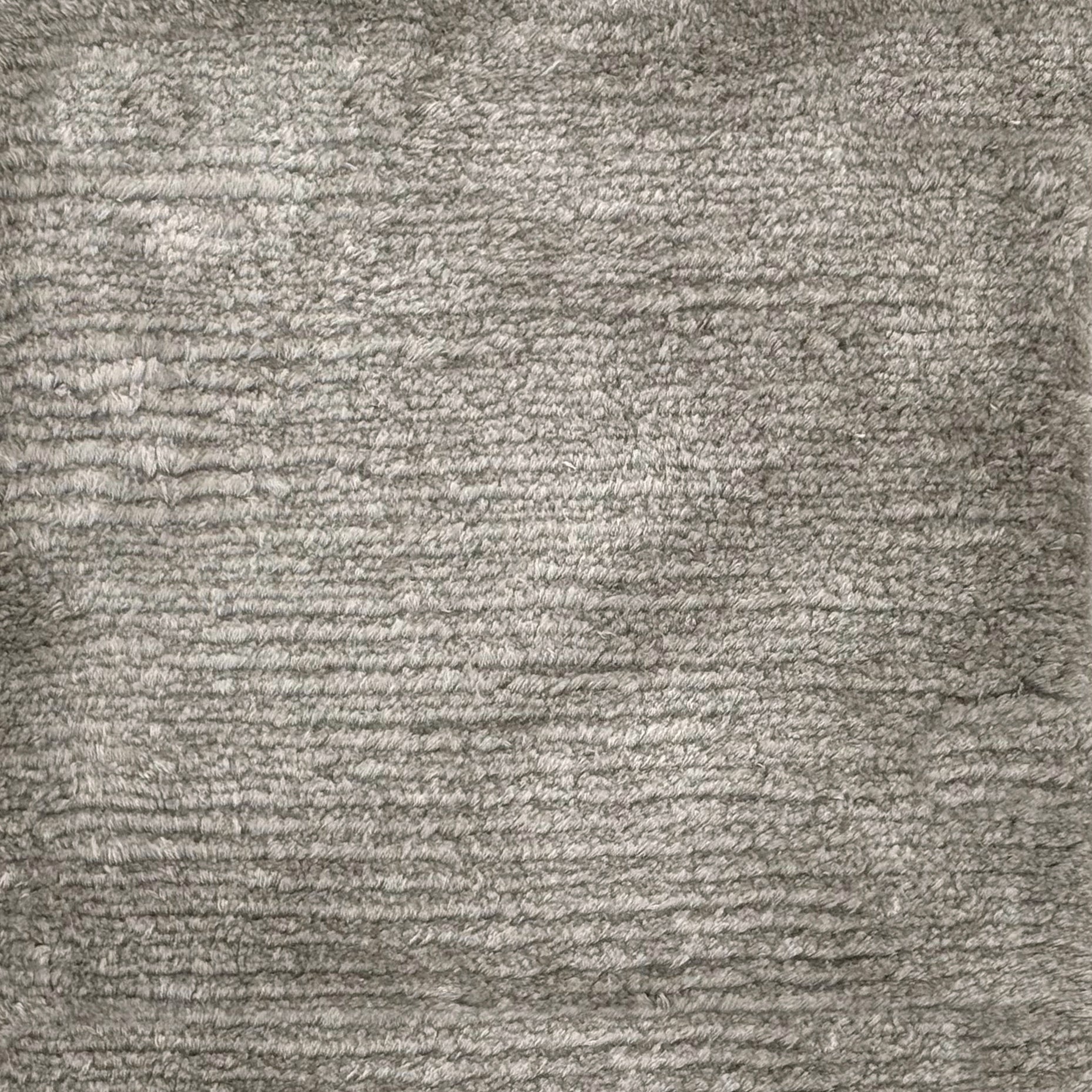Handknotted rug with solid cut pile in grey silk