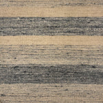 Flatwoven rug in a wide stripe in muted blue with strié cream and navy stripes.