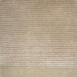 Handkotted rug in cream with a ribbed stripe design. 