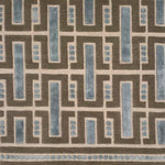Close-up of a handknotted geometric rug with blue and brown colors