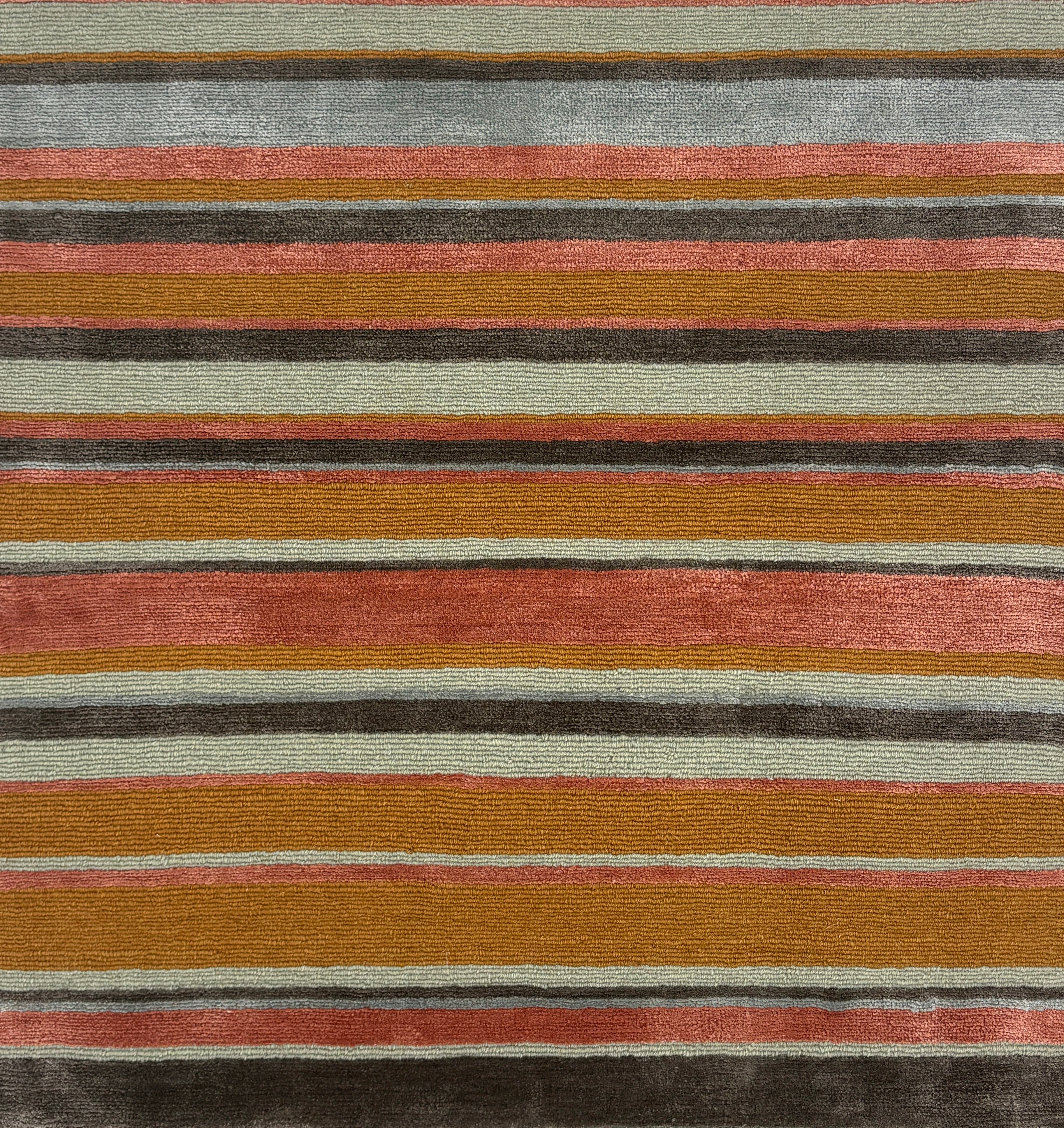 Striped handknotted rug with pink, tan, grey and aqua.