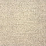 Flatwoven rug in a dense bouclé texture in cream.