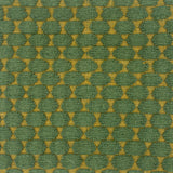 Handwoven rug with green and gold geometric pattern
