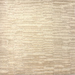 Handknotted rug in a textural hi lo pattern in cut pile and loop in cream. 