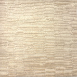 Handknotted rug in a textural hi lo pattern in cut pile and loop in cream. 