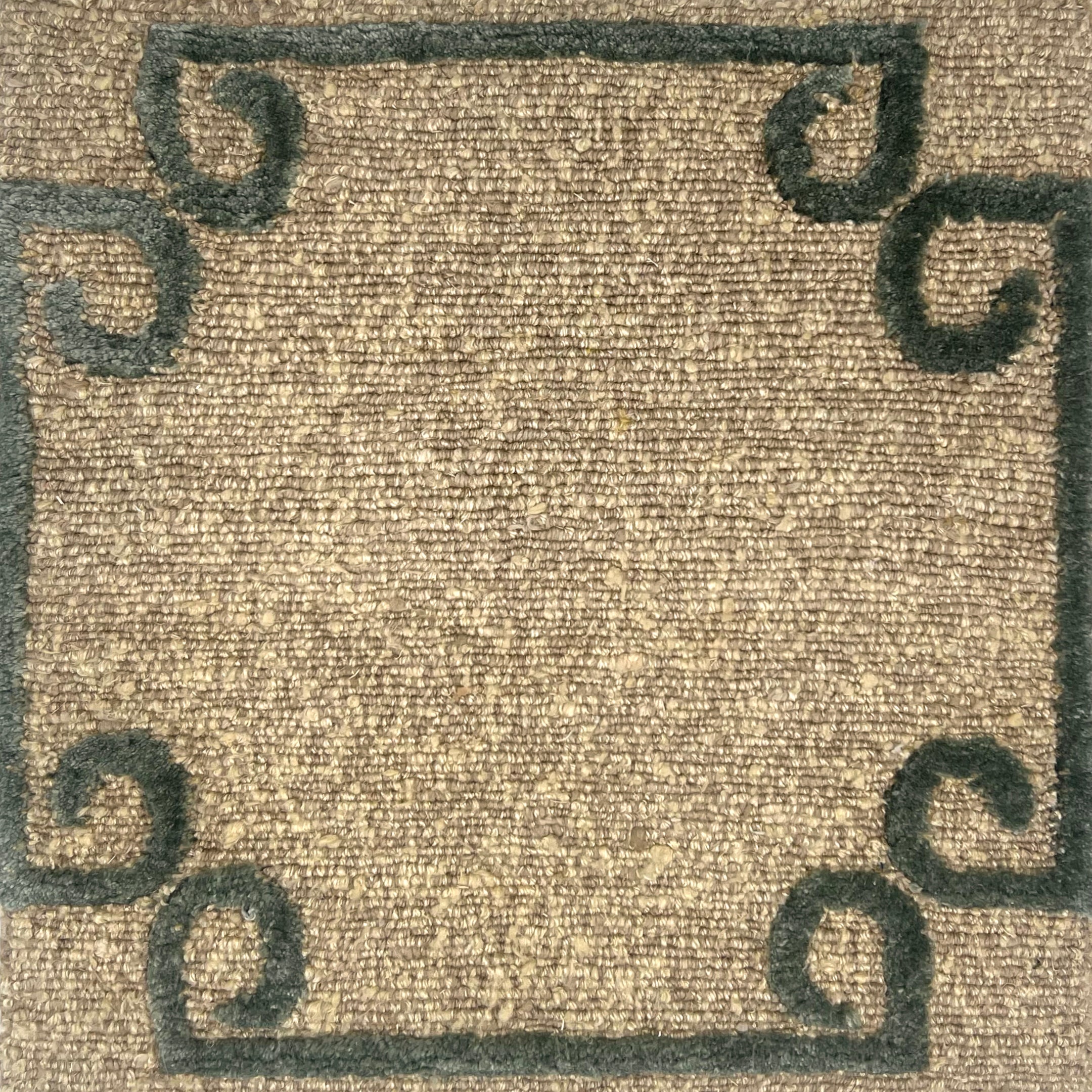 Hand knotted rug in a strie taupe field with a sage green raised curled corner border. 