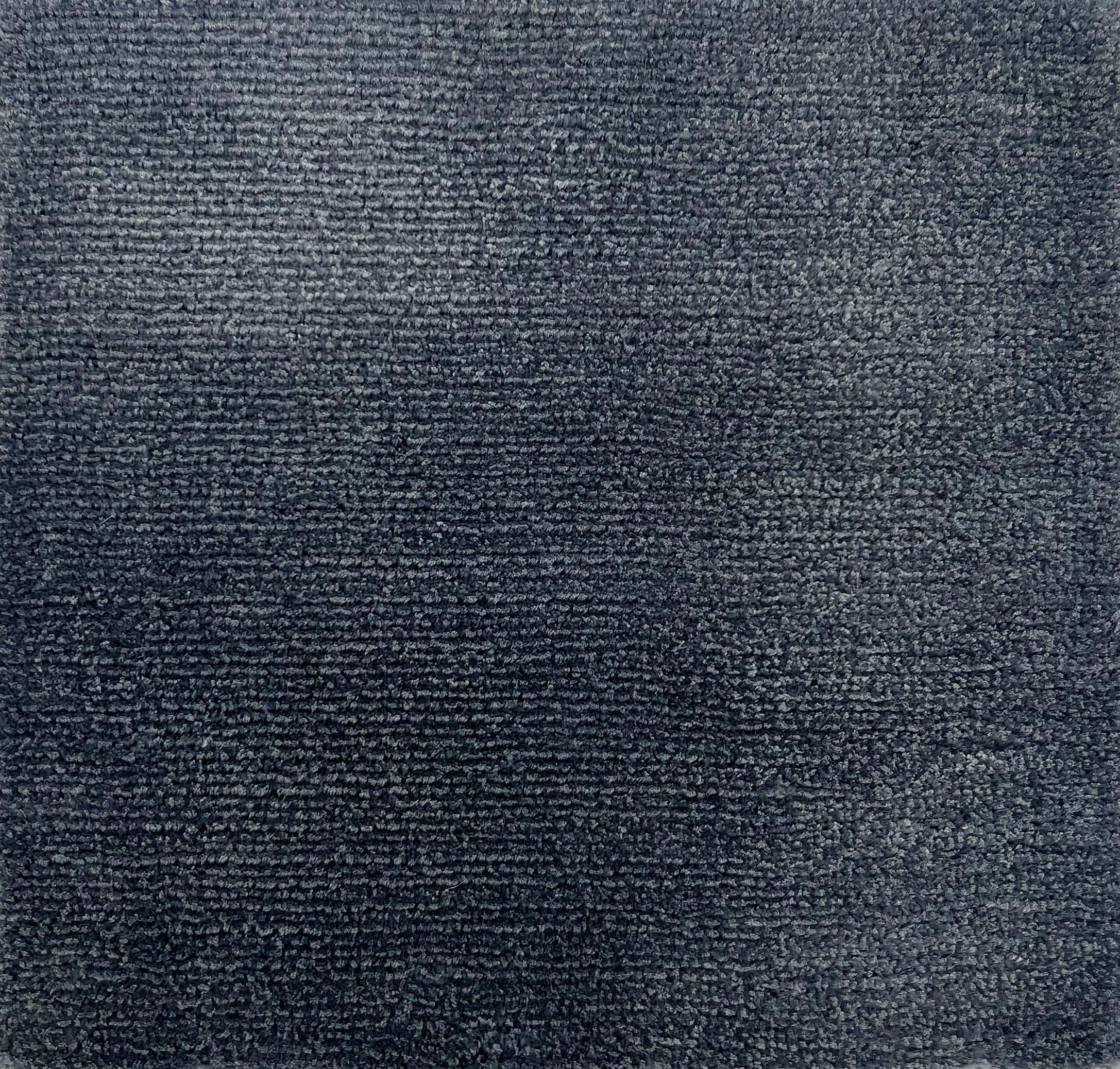 Handknotted cut pile solid rug in navy blue.