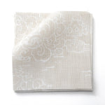 Fabric swatches in a painterly cloud pattern in white on a beige watercolor field.